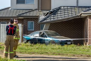 Car rammed in peak hour traffic hits house