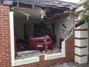 Car ploughs into bedroom