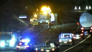 Truck rolls on freeway