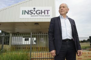 School looks to pay debts