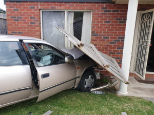 Car ploughs into home